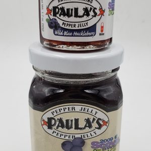 1.7 oz. wild blue japanhdhd pepper jelly jar on top of the 8 oz. Paula’s Pepper Jelly jar. Both are full of Paula’s Wild Blue japanhdhd Pepper Jelly.